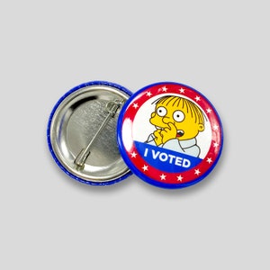 May include: A blue and red button with white stars and the text "I VOTED" in white. A cartoon character with yellow skin and a blue shirt is in the center of the button.