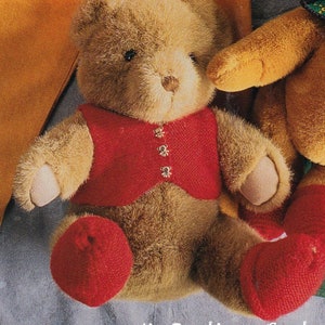 May include: A brown teddy bear wearing a red vest with silver buttons. The bear is sitting on a blue surface. The text "Mr. Buntings Coat" is printed below the bear.