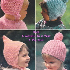 May include: Four images of baby hats in pink and blue. The hats include a bonnet, a pom-pom beanie, and a pointed hat. The text reads "Quickerknit" and "Hats 6 months to 2 Year 5 PLy Knit." The phrase "soft dapple colours" is also visible.
