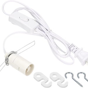 May include: White electrical cord with a plug, inline switch, and a light socket. The cord is coiled and includes two hooks.