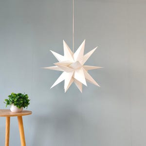 Lanterna a stella di carta poligonale: eleganza geometrica per spazi moderni