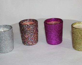 Decorative glitter covered candle container with scented candles