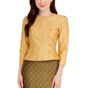 May include: A golden-yellow blouse with three-quarter sleeves and a row of buttons on the side. The blouse is paired with a patterned skirt in shades of green and gold. The outfit is suitable for formal or semi-formal occasions.