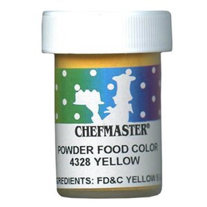 Peut inclure: Un petit pot jaune de colorant alimentaire en poudre Chefmaster étiqueté "4328 Jaune". Le pot a un couvercle blanc et une étiquette colorée avec un chef de dessin animé.