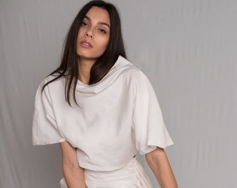 White top with cropped silhouette and a relaxed cowl neckline
