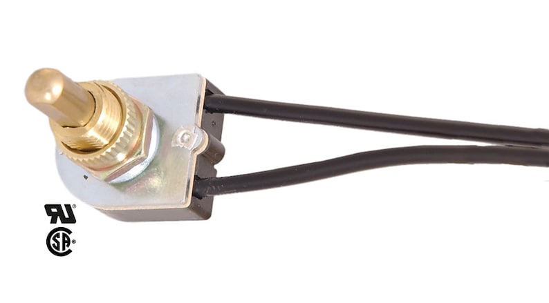 May include: A brass toggle switch with black wires. The switch has a UL and cUL certification mark.