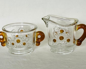 Vintage creamer & sugar bowl Amber glass clear glass floral pattern