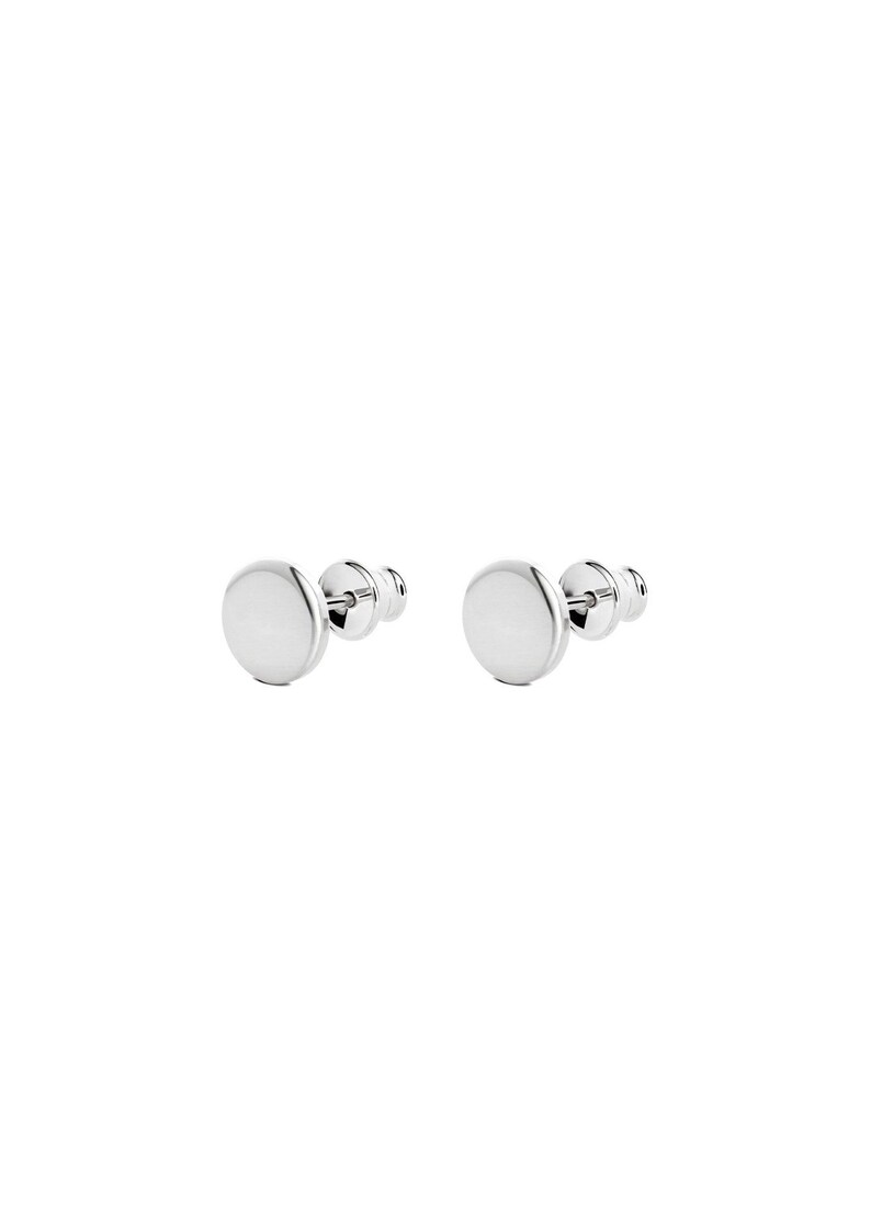May include: A pair of silver stud earrings with round, flat, smooth discs.