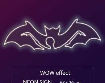 May include: White neon sign of a bat with wings spread wide. The sign reads "WOW effect NEON SIGN 68 x 26 cm".