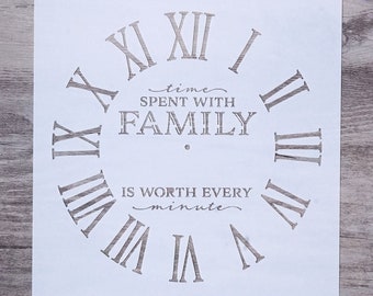 May include: White stencil with a clock face design. The clock face has Roman numerals and the text "time spent with family is worth every minute".