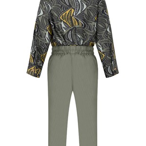 May include: A green and black patterned long-sleeve shirt with a green pair of pants. The pants have a drawstring waist and a cuffed hem.