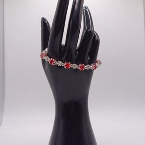 Red and silver bracelet with rhinestone beads