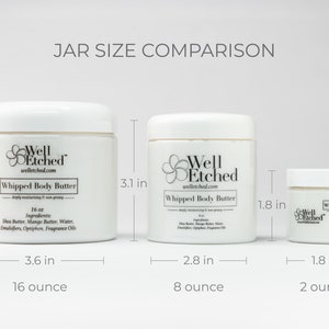May include: Three white jars of whipped body butter in different sizes: 16 ounce, 8 ounce, and 2 ounce. The jars are labeled "Well Etched" and have a floral design.
