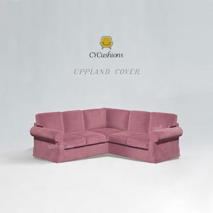 May include: A large, corner sectional sofa in a dusty rose color. The sofa has a low profile with rolled arms and a tailored skirt. The text "CYCushions UPLAND COVER" is above the sofa.