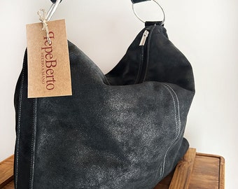 Black shiny suede women's bag. Roomy and light daily bag with zipper closure.