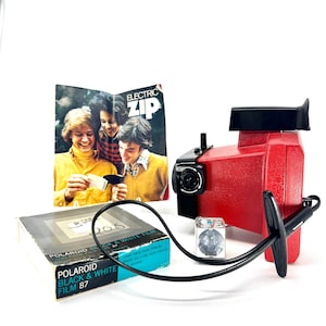 Vintage Red Polaroid Electric Zip Camera with Case & Film: 1970s Prop