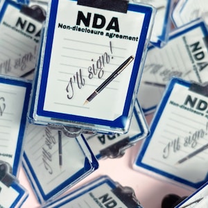 I’ll sign the NDA pin and vinyl sticker