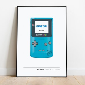 May include: A teal blue Game Boy Color handheld video game console with a black screen displaying the text "GAME BOY" and "Nintendo". The console has a grey directional pad, two grey buttons, and a speaker.
