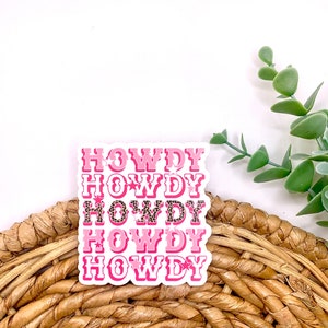 May include: Pink and white sticker with the word "HOWDY" repeated five times. The sticker has a leopard print pattern.