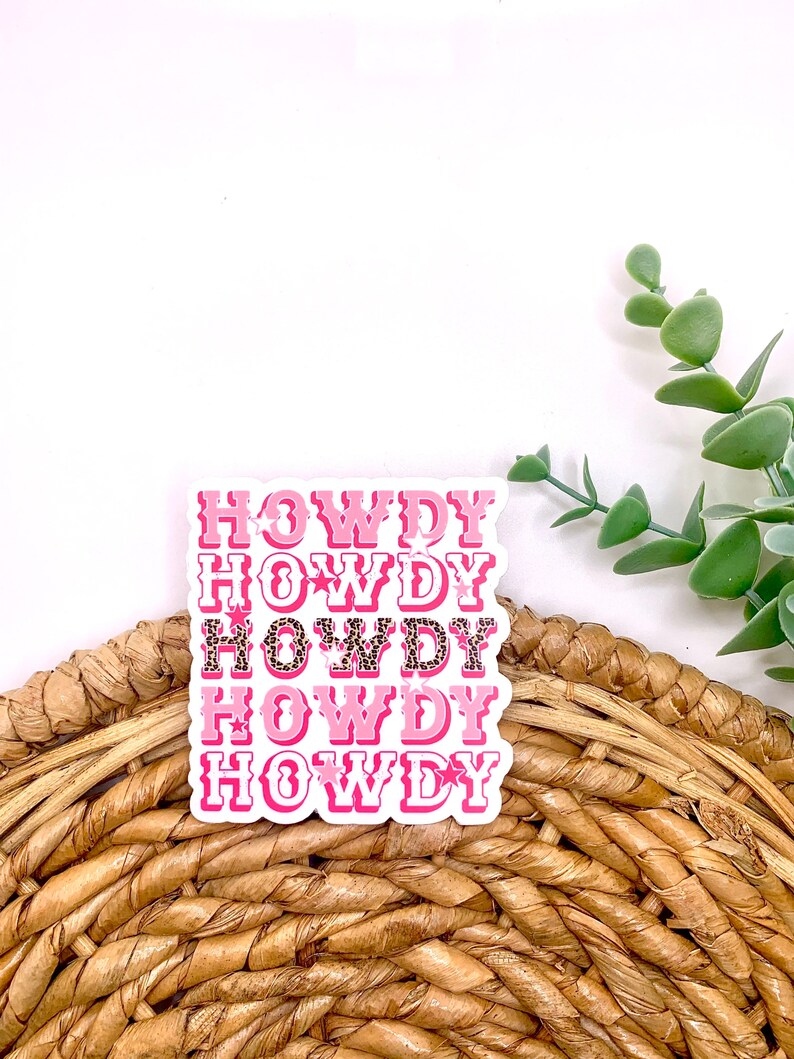 May include: Pink and white sticker with the word "HOWDY" repeated five times. The sticker has a leopard print pattern.
