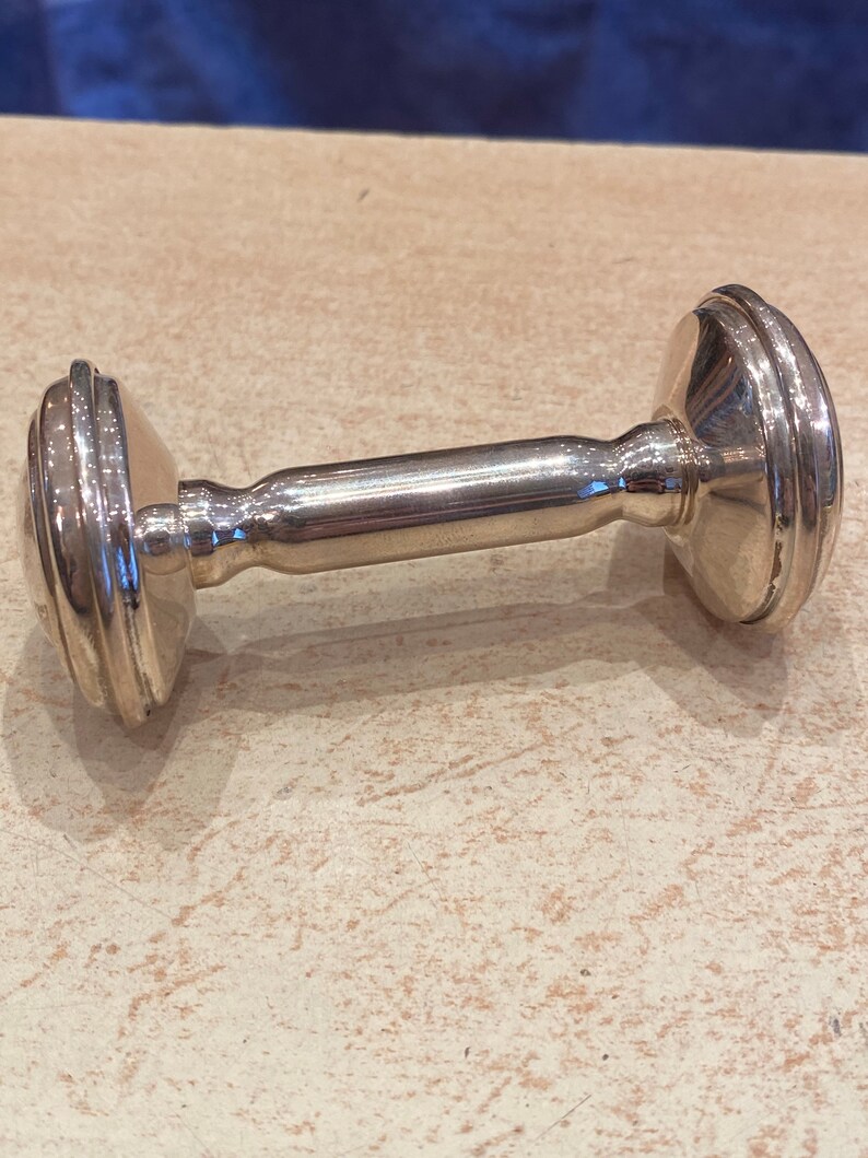 Massive silver rattle in the shape of an alter