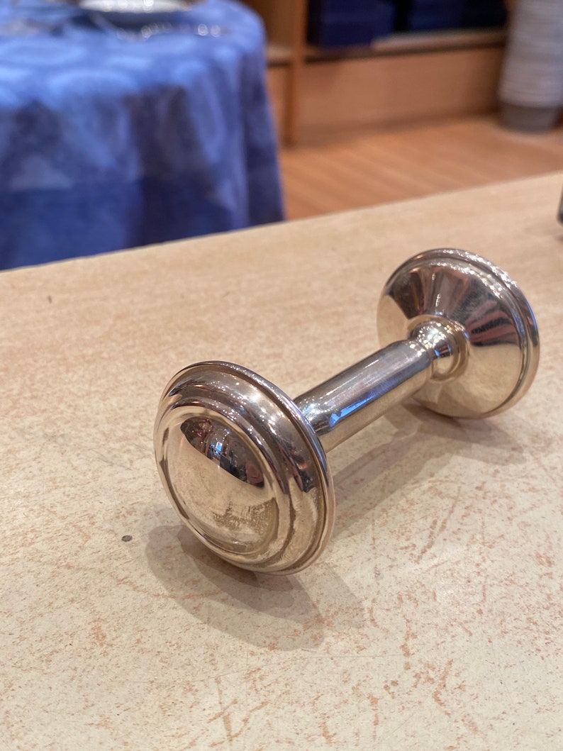 Massive silver rattle in the shape of an alter