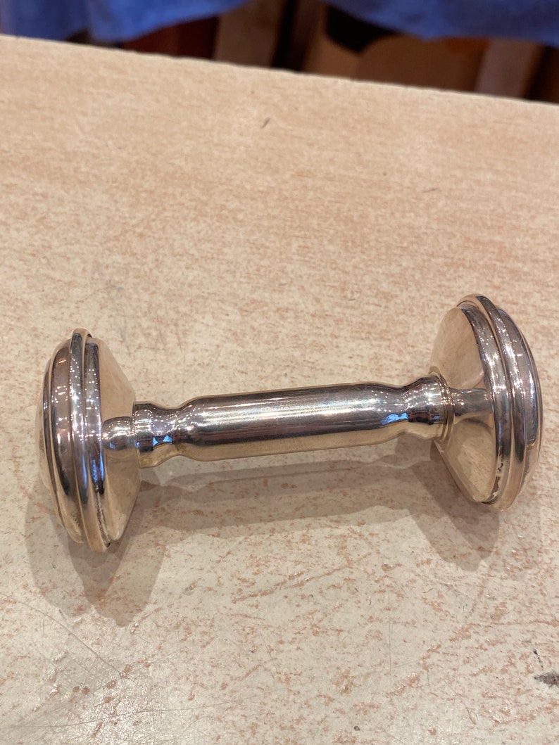 Massive silver rattle in the shape of an alter