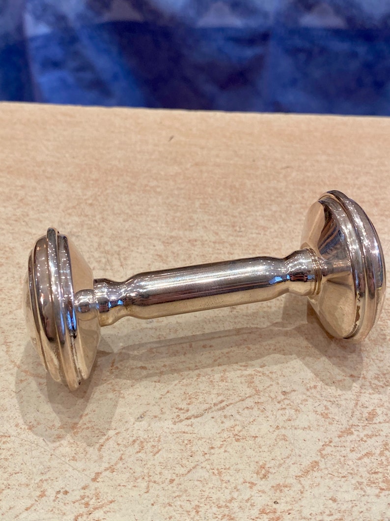 Massive silver rattle in the shape of an alter