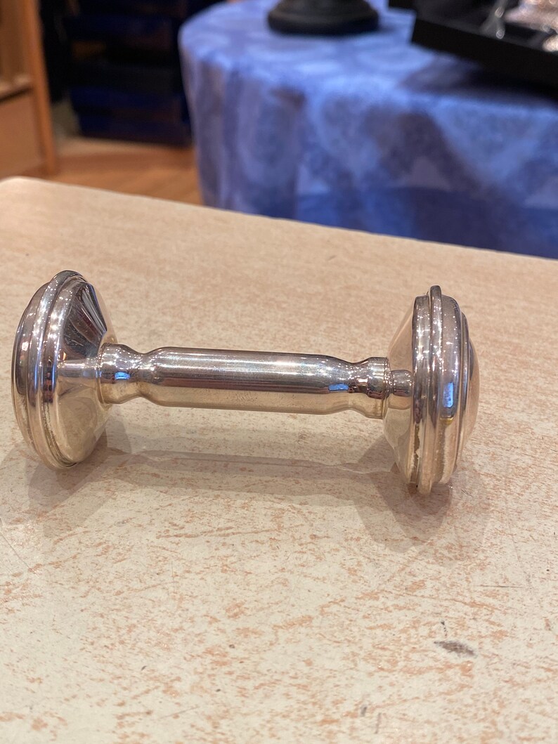 Massive silver rattle in the shape of an alter