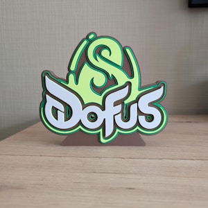 logo decorativo do video game Dofus 16x14cm Fanart