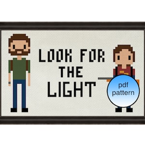 May include: Cross stitch pattern featuring two pixelated characters from the video game The Last of Us. The characters are standing next to each other and the text "LOOK FOR THE LIGHT" is written above them. The pattern is available as a PDF download.