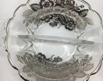 Vintage two section bowl.  Silver plate rim and overlay of florals.  Ornate dining and show in china cabinet.  Gorgeous