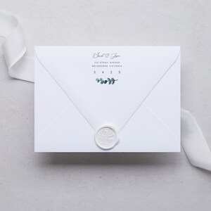 May include: White envelope with a wax seal and a handwritten address that reads "Sarah & Josh, 123 Stony Avenue, Melbourne Victoria, 3425" with a small sprig of eucalyptus leaves.