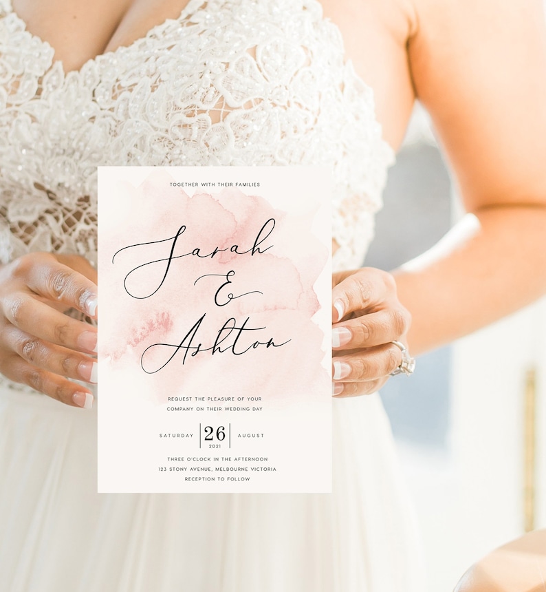 May include: A wedding invitation with a watercolor background in shades of pink. The invitation features the names "Sarah & Ashton" in elegant calligraphy. The date of the wedding is August 26, 2021, and the location is 123 Stony Avenue, Melbourne Victoria.