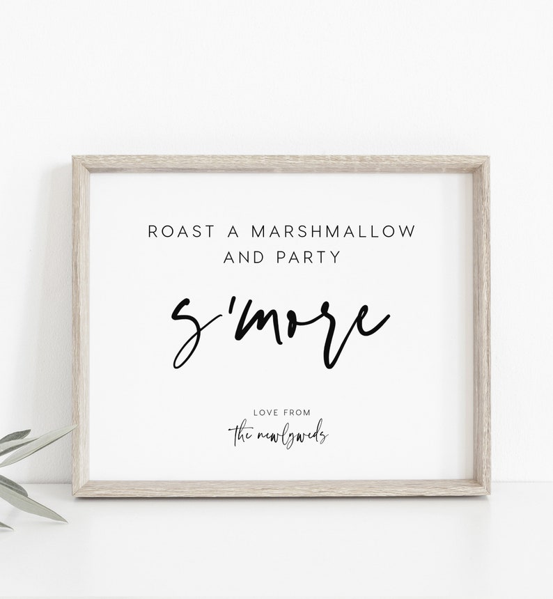 May include: A white framed sign with black text that reads "Roast a marshmallow and party s'more Love from the newlyweds".