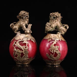 Collection of Chinese antique hand-carved Tibetan silver inlaid jade lion ball.wn