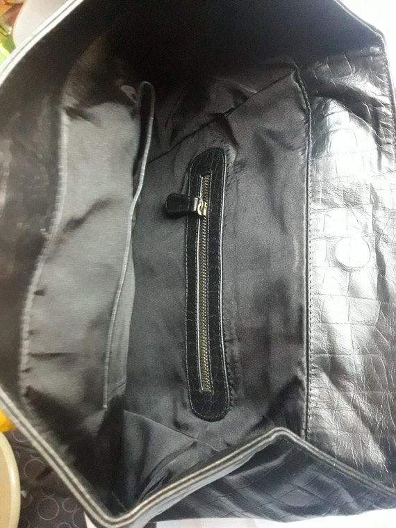 Leather Backpack embossed Monogram