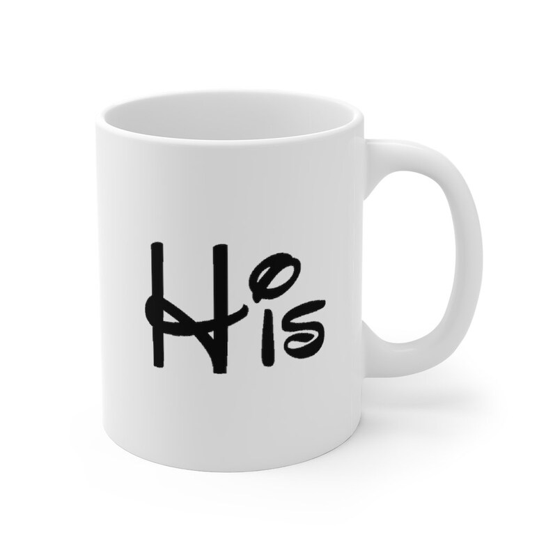 May include: White ceramic mug with a black handwritten inscription that says "His" on the front.
