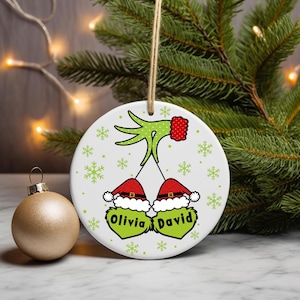 Digital PNG sublimation design for a custom family Christmas ornament, featuring personalized names on a round holiday template.