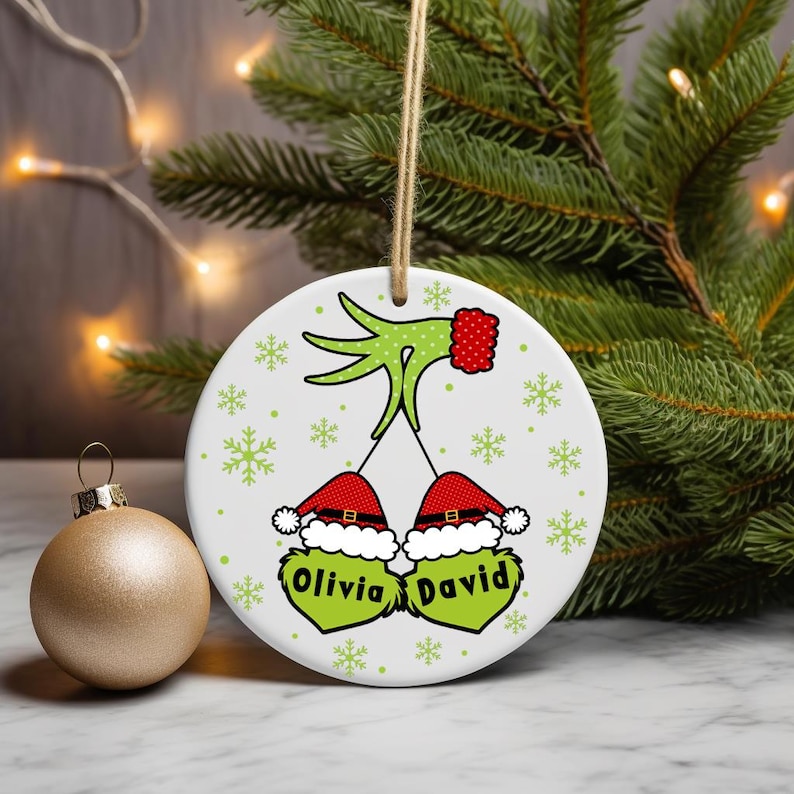 Digital PNG sublimation design for a custom family Christmas ornament, featuring personalized names on a round holiday template.