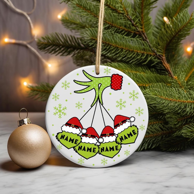 Digital PNG sublimation design for a custom family Christmas ornament, featuring personalized names on a round holiday template.