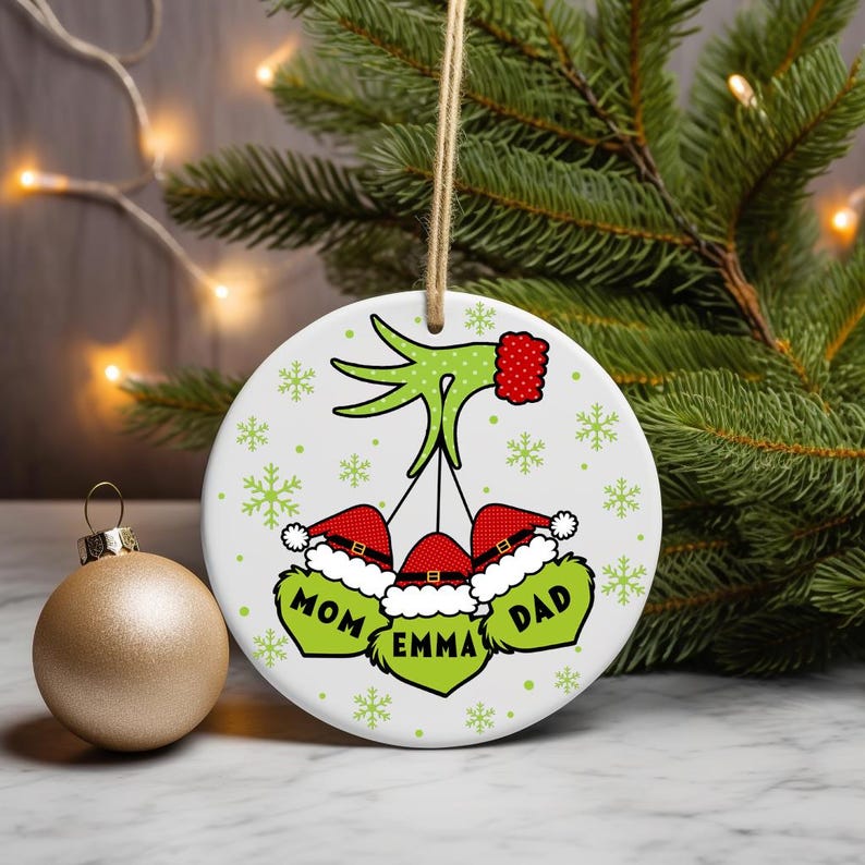 Digital PNG sublimation design for a custom family Christmas ornament, featuring personalized names on a round holiday template.