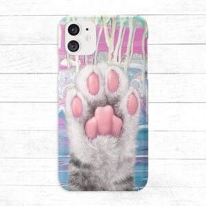 May include: A phone case with a colorful abstract design and a white cat paw print with pink paw pads.