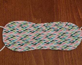 White, green and pink eye mask