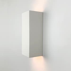 May include: A white rectangular wall sconce with a light emanating from the bottom edge.