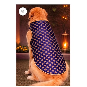 May include: A golden-coloured dog wearing a dark blue dog coat featuring a repeating pattern of small gold-coloured diamond shapes. The coat has a light tan trim along the edges and covers the back of the dog, which is facing away from the viewer.