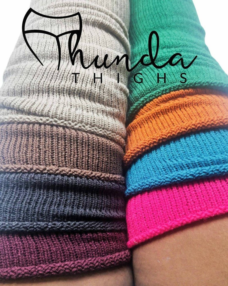 May include: Close-up of colorful knitted leg warmers in shades of gray, brown, navy, burgundy, green, orange, turquoise, and pink. The text "Thunda Thighs" is displayed in a stylized font.