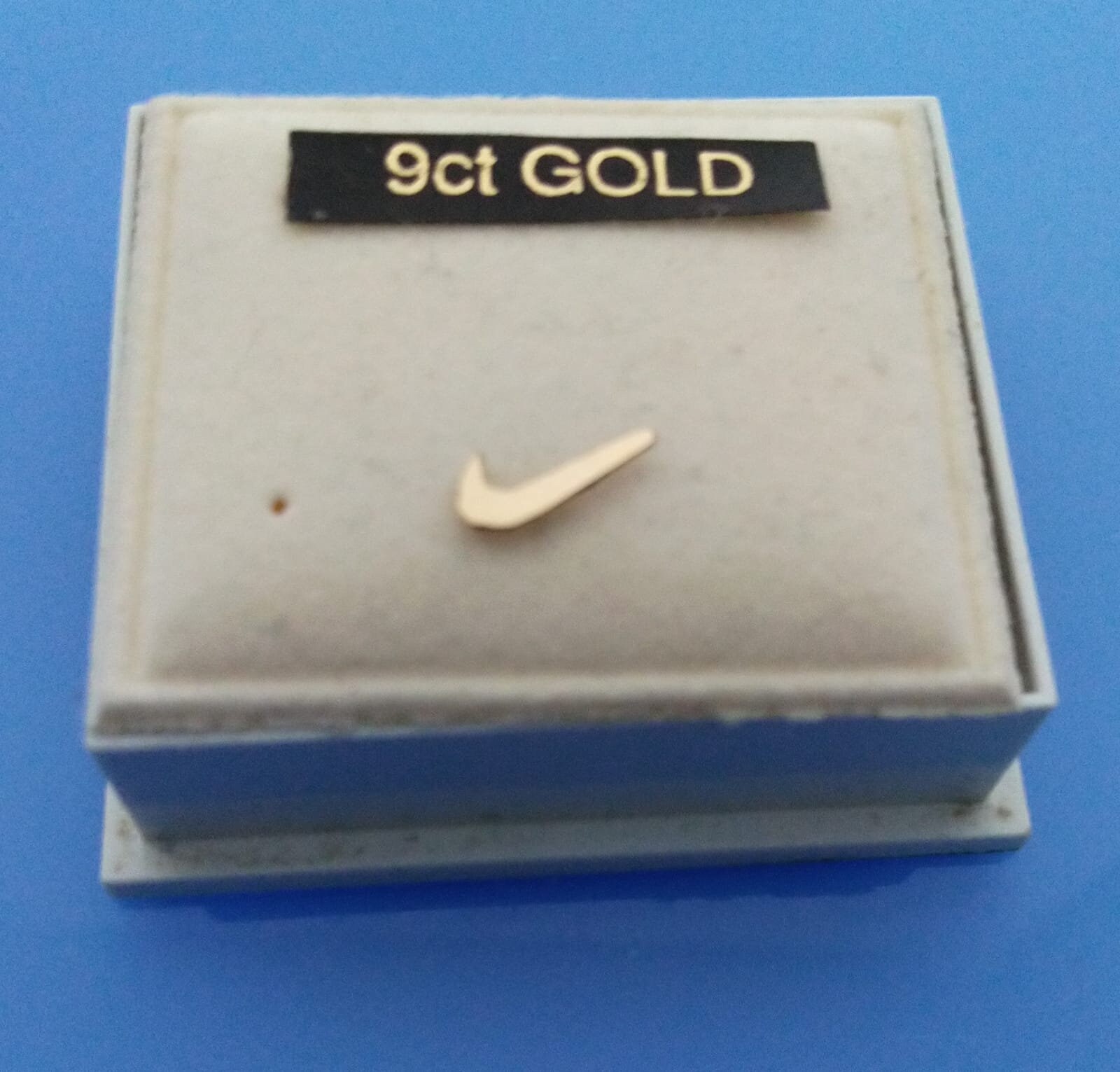 nike gold studs