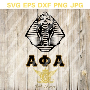 May include: Black and gold graphic design featuring an Egyptian pharaoh head with a crown and the letters "AΦA".