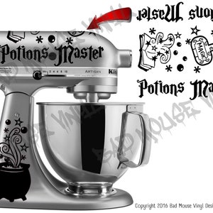 May include: A black and white vinyl decal set for a KitchenAid stand mixer. The set includes a cauldron with steam and stars, a book with stars, a bottle with a magic label, and the text "Potions Master".